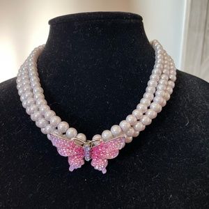 Multi pearl strand necklace with butterfly